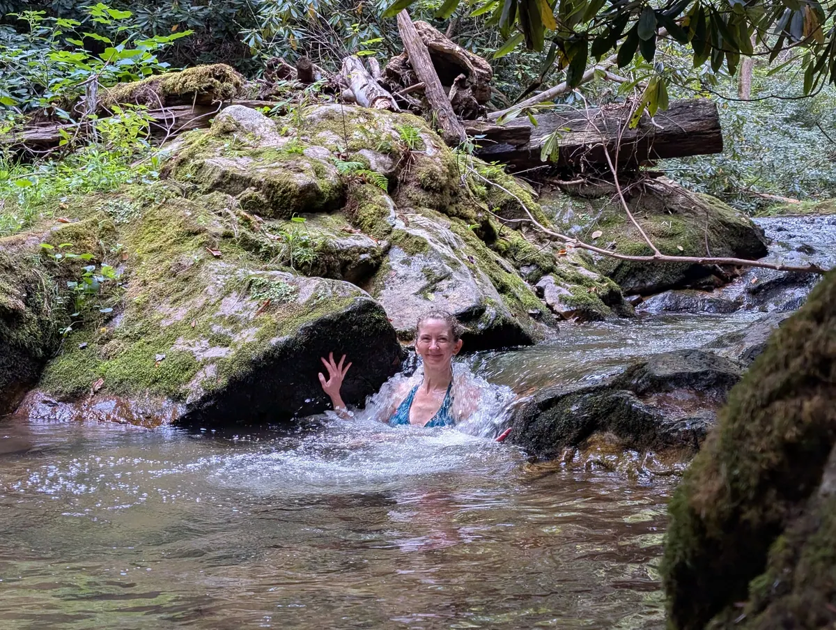 Jen waving from a pool in the mountain stream where we cooled off
