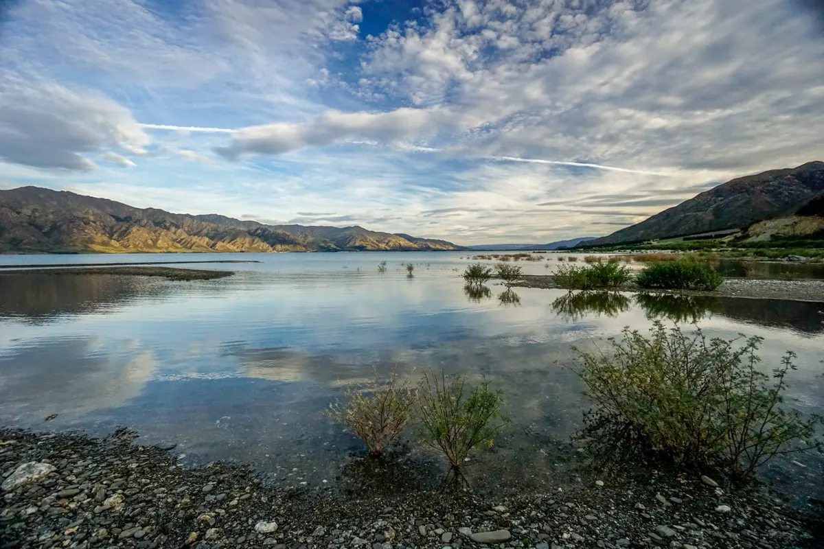 Lake Hāwea mirroring the surrounding mountains, New Zealand