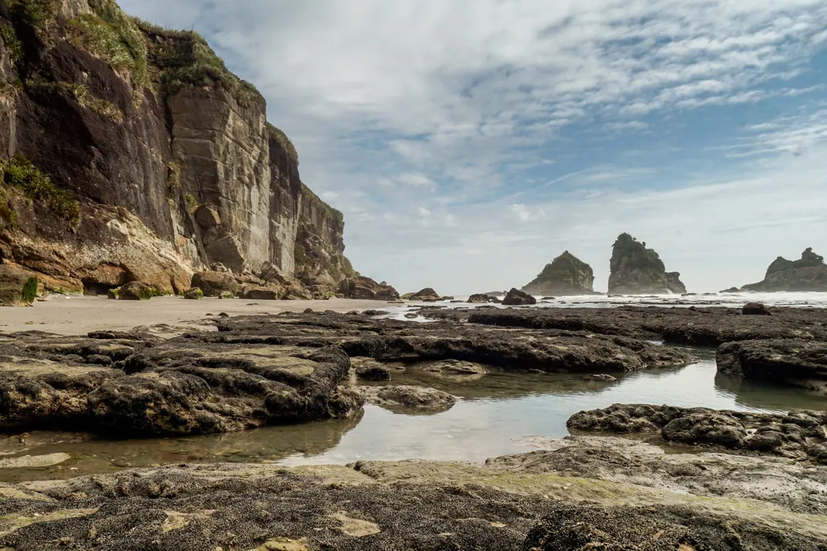 Sea stacks and tide pools on the wild Motukiekie coast, New Zealand