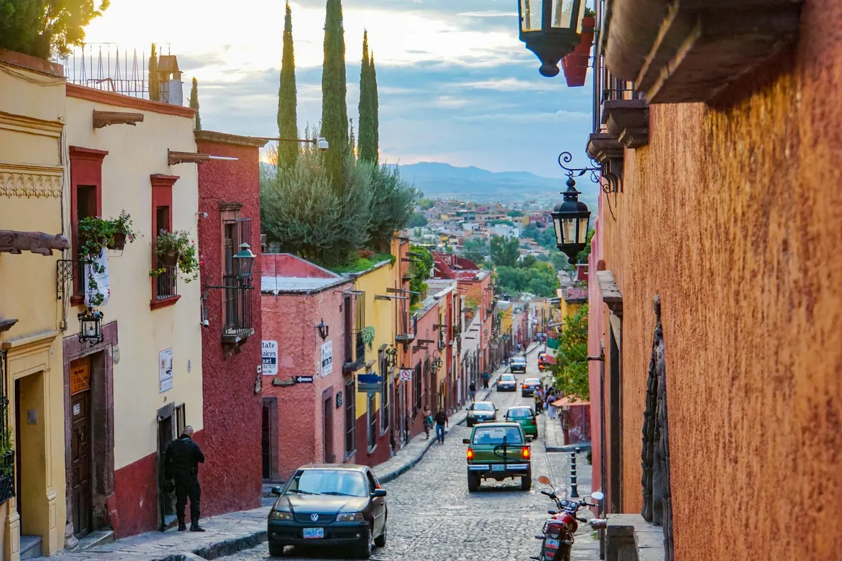 Pastel façades and papel picado during Día de los Muertos, San Miguel de Allende