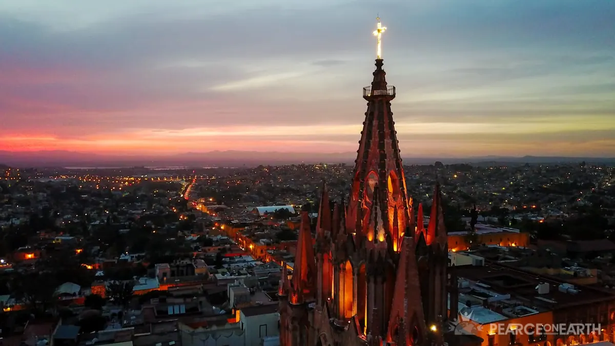 The parroquia spire silhouetted against a burning sky, San Miguel de Allende, Mexico