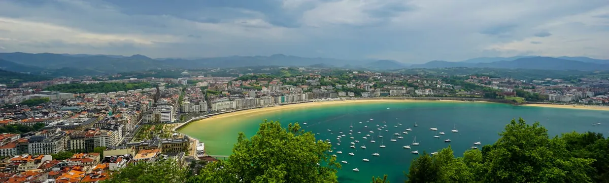The bay of San Sebastián as clouds break over the water, Spain